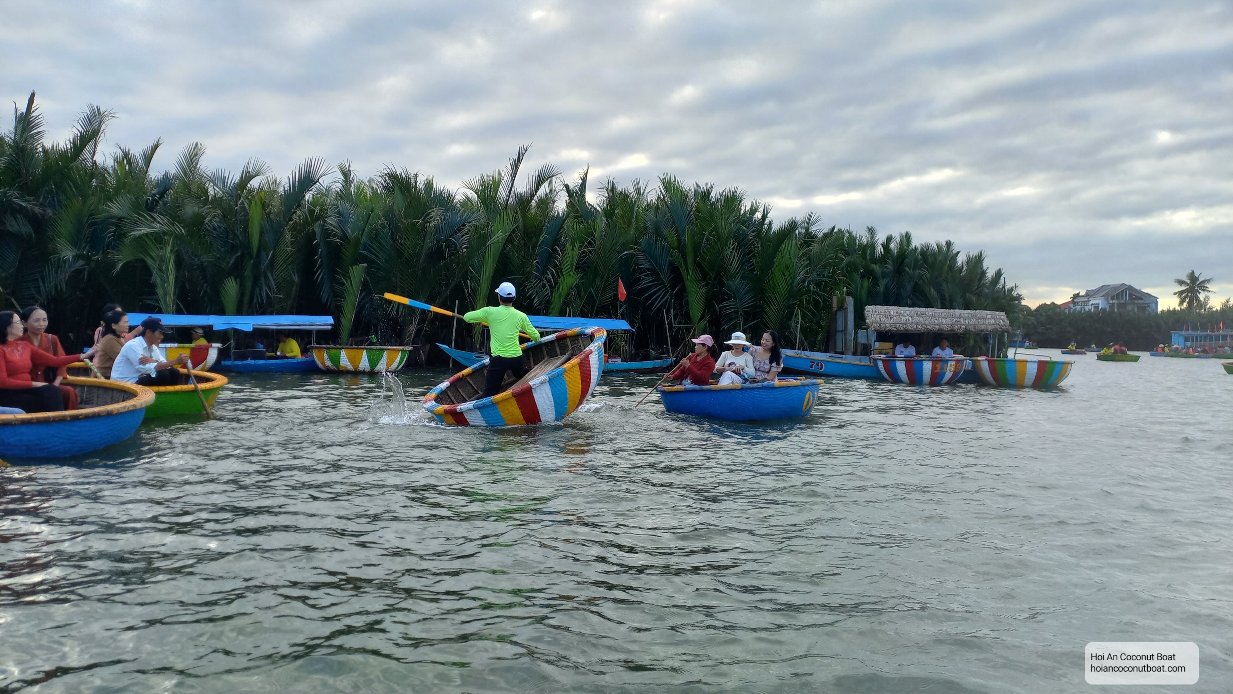 Fast spinning coconut basket boat is performed by boatman